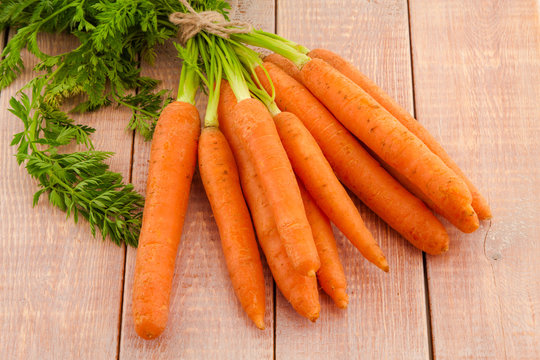 Fresh organic carrots with their tops