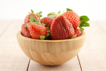 Ripe red strawberries in a bowl