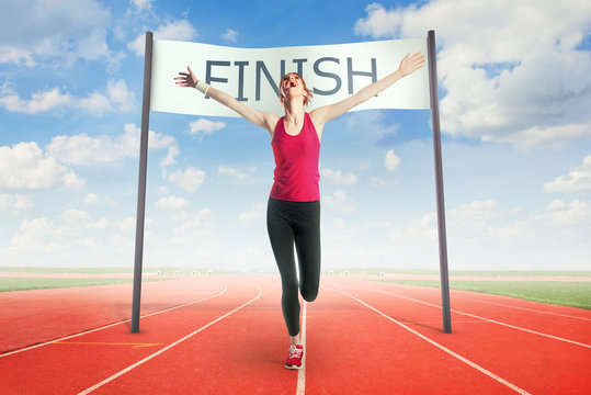 Woman crossing the finish line Stock Photo Adobe Stock