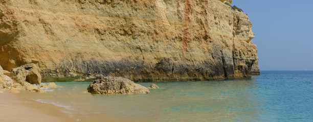 Fototapeta na wymiar Colorful rocks on ocean, panorama