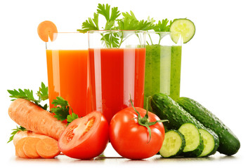 Glasses with fresh vegetable juices isolated on white