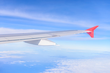 Obraz premium Looking through window aircraft during flight in wing with a nic