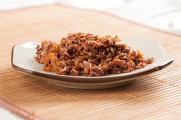 Red rice with onion and carrot