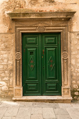 Beautiful old green wooden in historic Sibenik, Croatia