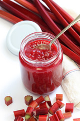 homemade rhubarb jam in jar isolated on white background