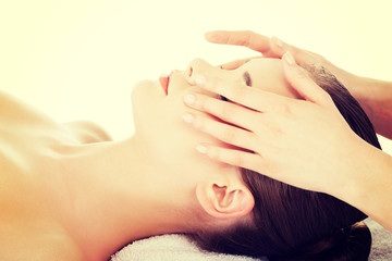 Fototapeta premium Relaxed woman enjoy receiving face massage