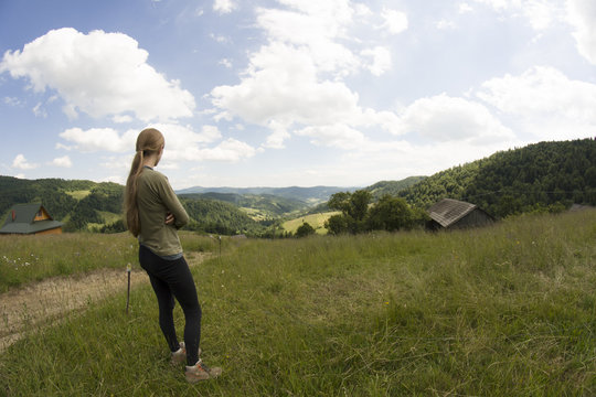 Woman admires mountain view, Gorce Mountains, Poland