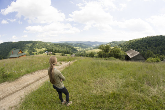Woman admires mountain view, Gorce Mountains, Poland