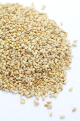 Natural sesame seeds on a white