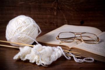 white clews with book and glasses