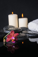 Beautiful spa concept of zen stones with drops, purple orchid (p