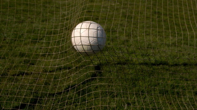 Football hitting the back of the net