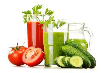 Glasses with fresh vegetable juices isolated on white
