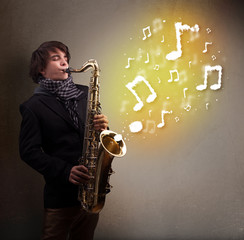 Handsome musician playing on saxophone with musical notes