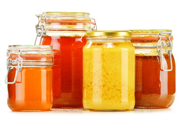 Composition with jar of honey isolated on white