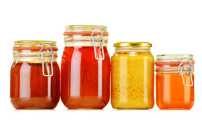Composition with jar of honey isolated on white