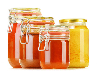 Composition with jar of honey isolated on white