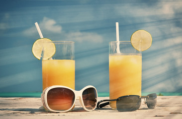 Sunglasses and orange juice