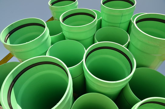 Stacks of green PVC water pipes