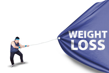 Fat man pulling a weight loss banner 2