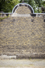 flip side of an old cemetery brick wall