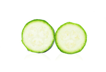 Zucchini. Sliced green courgette on white background