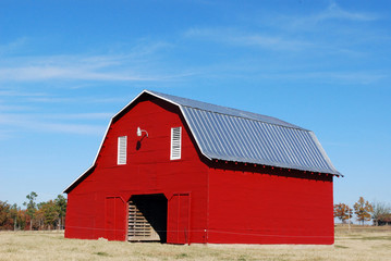 Red barn with metal gray roof