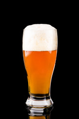 Glass with beer on a black background