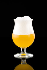 Glass with beer on a black background