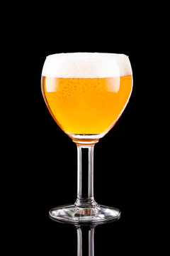 Glass with beer with on a black background