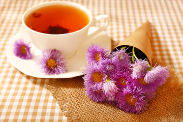 Fototapeta na wymiar Cup of fresh herbal tea on table