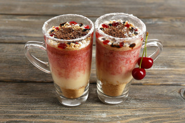 Tasty cherry dessert on table