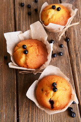 Naklejka na ściany i meble Tasty cupcakes with blueberries on table close-up