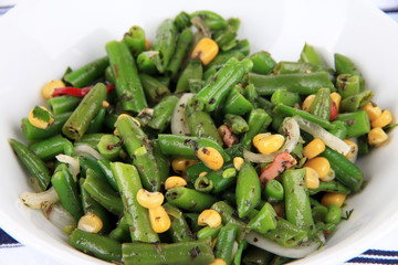 Salad with green beans, ham and  corn in bowl, close-up