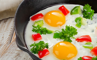 Fried eggs and vegetables