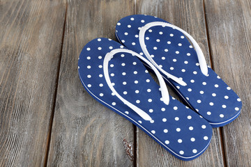 Color flip-flops on wooden background