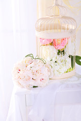 Beautiful wedding bouquet and birdcage