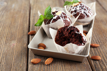 Tasty cupcakes with nuts on table close-up