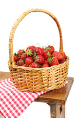 Fototapeta na wymiar Fresh strawberries in basket on white wall background