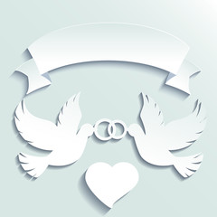 Obraz premium Doves holding wedding rings