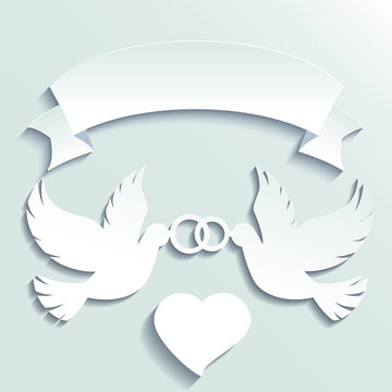Doves holding wedding rings