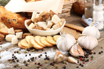 Homemade croutons on table in kitchen, close up