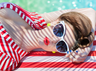 Colorful summer portrait of young attractive woman