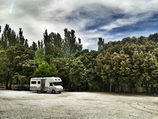 Camper with forest on background
