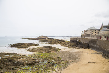 view of the shore from saint malo on a cloudy day
