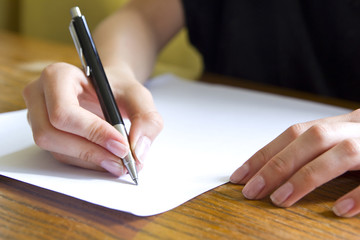 female student writing closeup