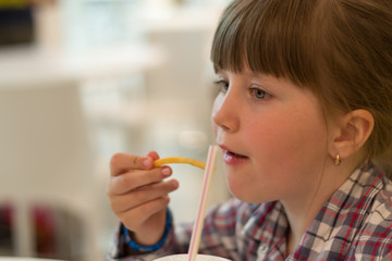 girl eating fries