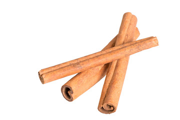 dried cinnamon sticks on white background