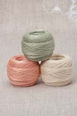 Thread Spools On Natural Linen Background