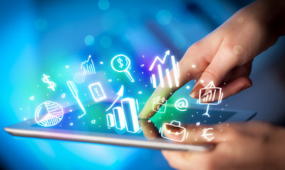 Hand touching tablet pc, charts concept